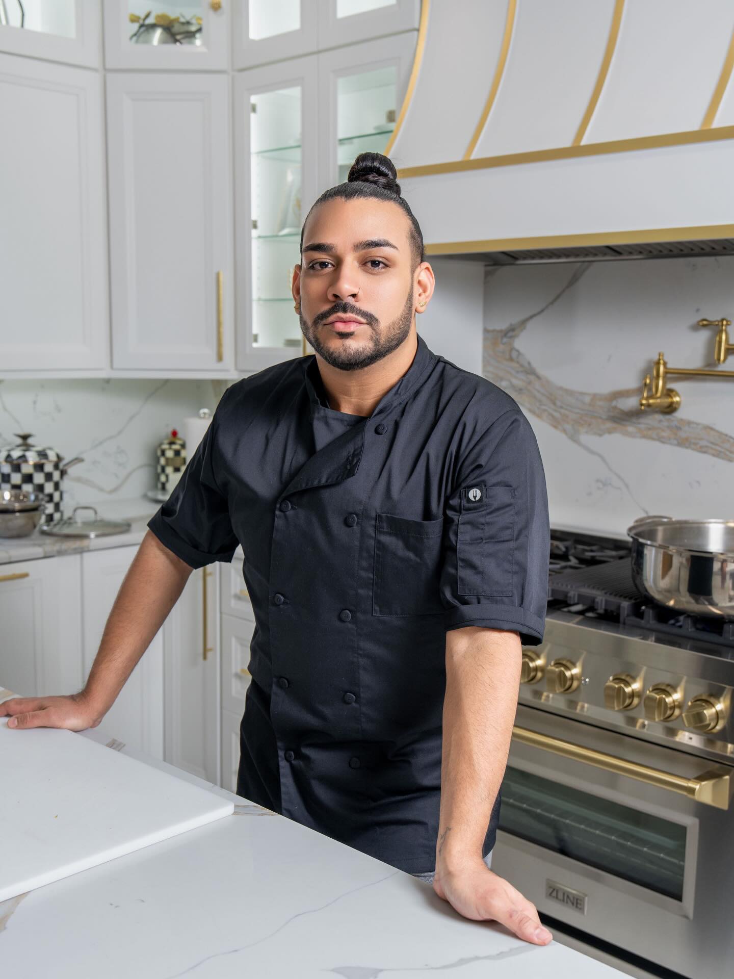 Chef Gabriel Bido preparing food for a GB Cuisine event